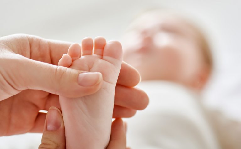doctor examining a baby