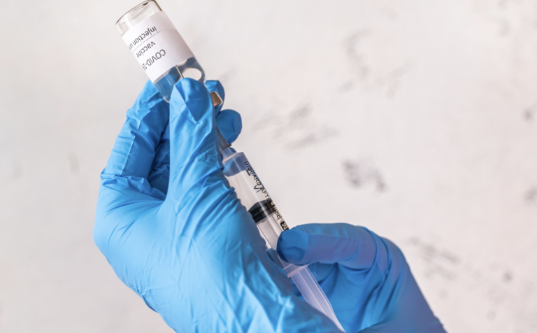 syringe with pfizer vaccine