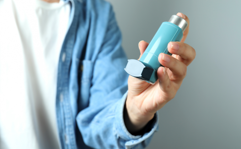 doctor with asthma inhaler in his hand