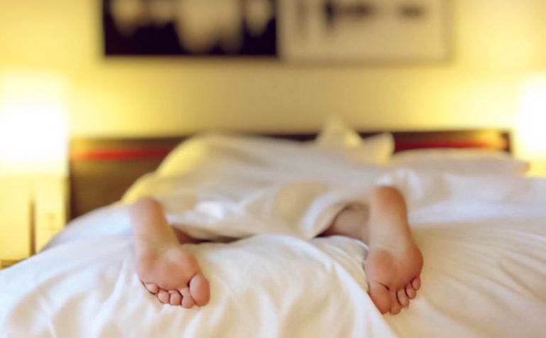 lady in bed about to be massaged
