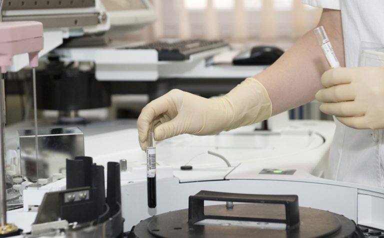 bowel cancer doctor with syringes