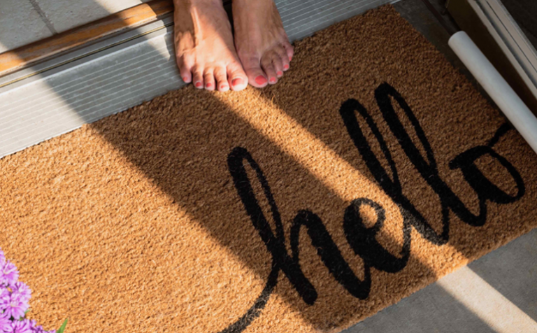 welcome mat that says hello